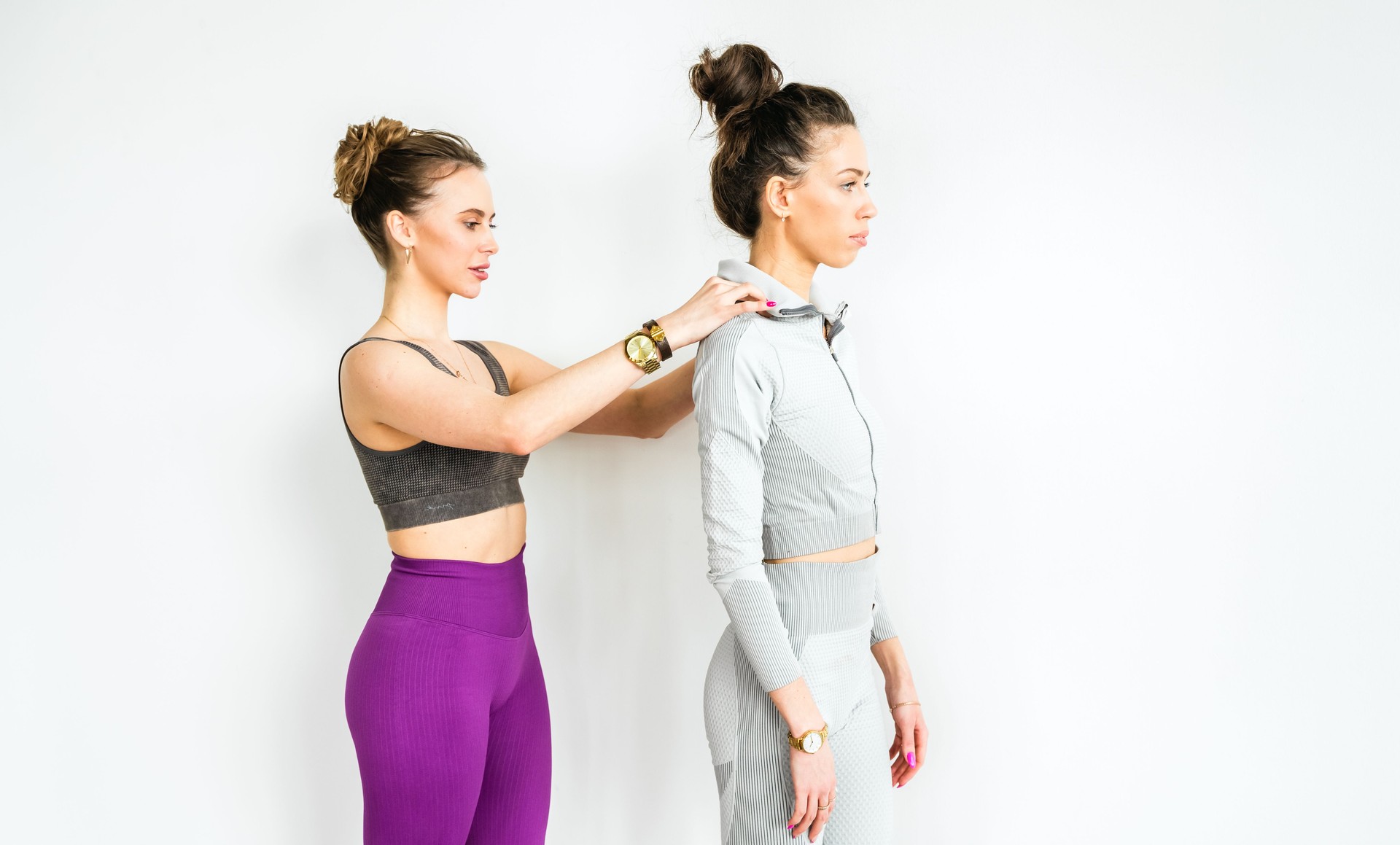 Exercises for posture, smooth straight back, spine. Slim woman training with yoga coach. Private lessons with personal trainer, fitness instructor. Workout, exercises in fitness gym
